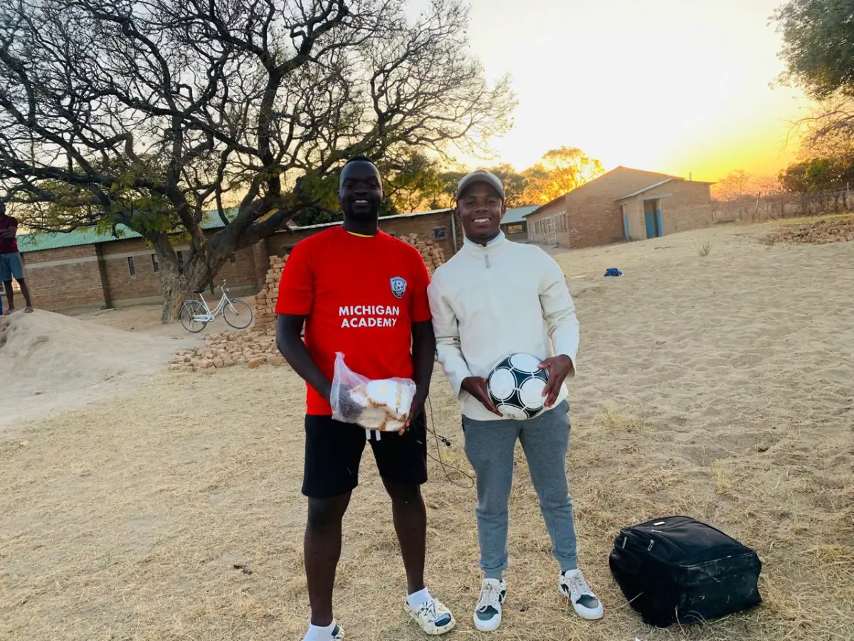 Academy coaches in Zambia with a Star Kick football