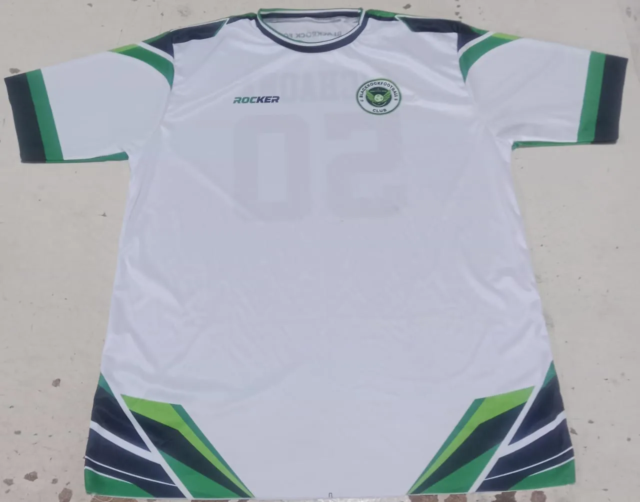 Finished sublimated shirt laid flat for final inspection